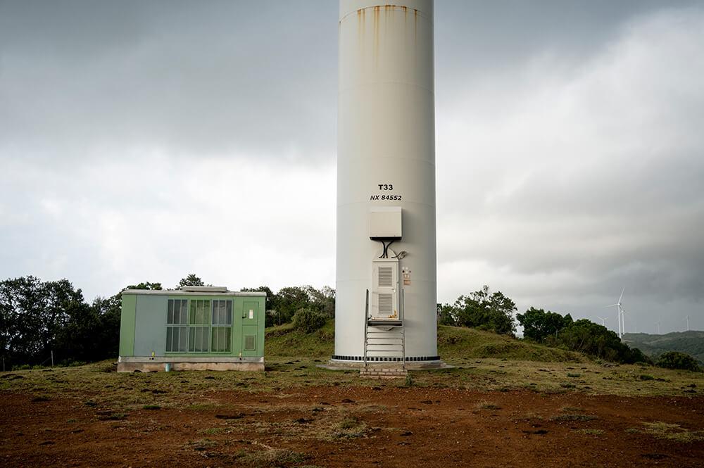 Base of a turbine tower, with its access door and control container